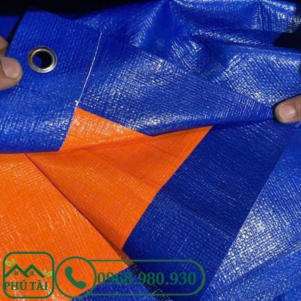 Phân Biệt Bạt Xanh Cam Loại 1 Và Loại 2 – Nên Chọn Loại Nào Cho Công Trình? Bạt xanh cam loại 1 màu tươi sáng hơn, tấm bạt mềm, sợi đan nhỏ